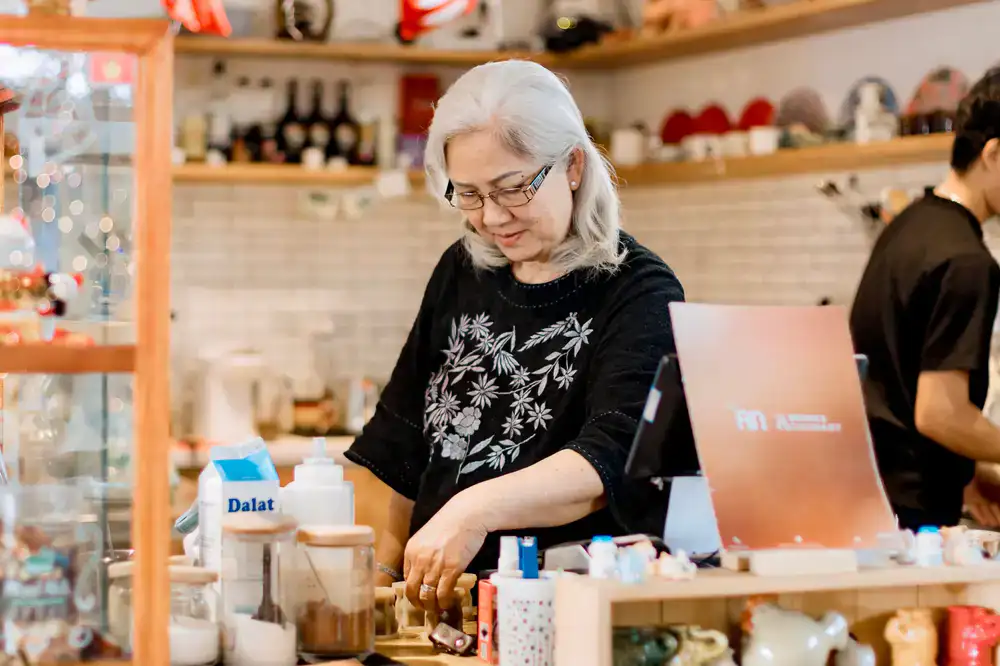 Barista smiling behind the counter