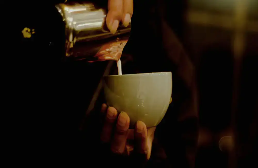 Barista pouring latte art